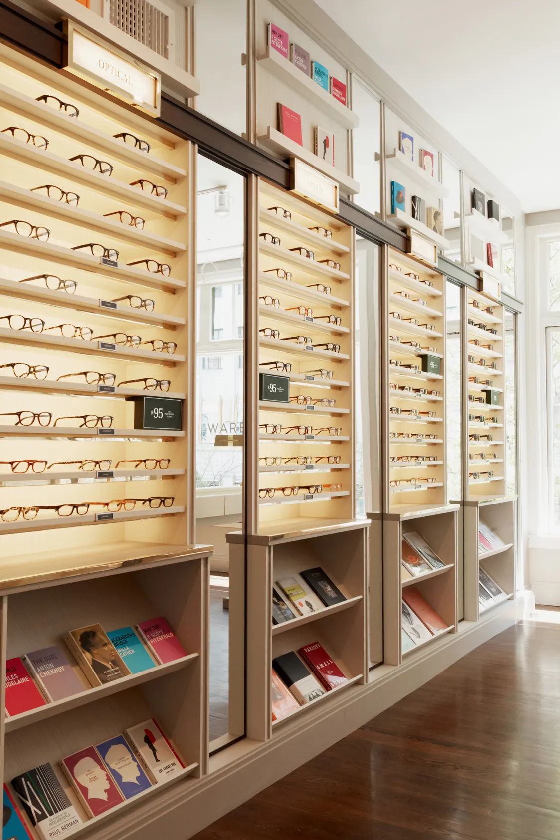Warby Parker Boston, frame shelving around a fitting table