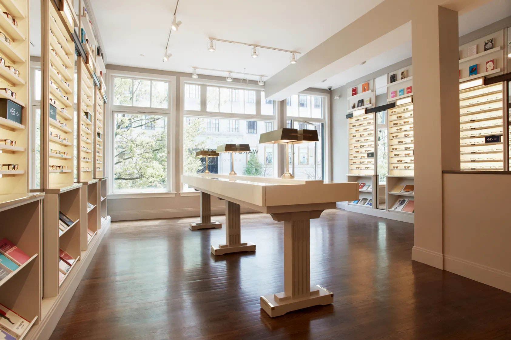 The full length of the shop, lit from the windows as well as the shelving.